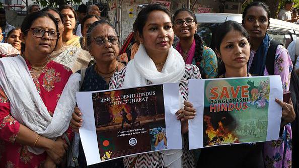 Women protestors from Vishva Hindu Parishad (VHP), Bajrang Dal and other Hindu organization gather holding placards against the atrocities committed on Hindus in Bangladesh and seek release of International Society for Krishna Consciousness (ISKCON) monks near the Bangladesh Consulate General offic