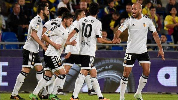 Valencia's players celebrate scoring against Las Palmas