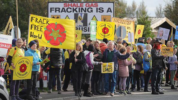 Environmental protesters gather near a gas fracking site which has been given the green light by the government this week on October 8, 2016 in Great Plumpton near Blackpool, England. The 'Lancashire Responds' rally and demonstration comes in the wake of the government giving the green light for fracking to start at the Preston New Road site.