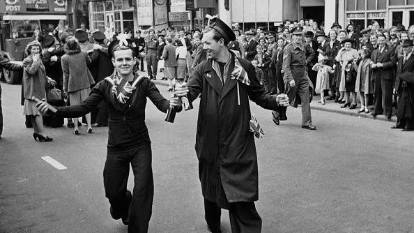 Servicemen celebrating in London on VE Day 1945