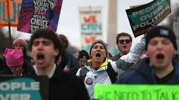 Protesters yell during the People's March