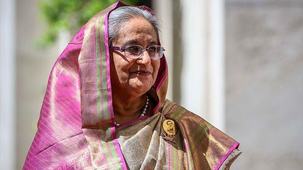 Bangladesh Prime Minister Sheikh Hasina seen in a pink sari and golden pin