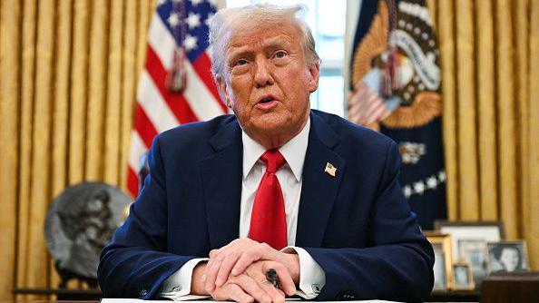 US President Donald Trump speaks to the press as he signs an executive order to create a US sovereign wealth fund, in the Oval Office of the White House on February 3, 2025