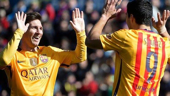 Luis Suarez (right) celebrates with Lionel Messi