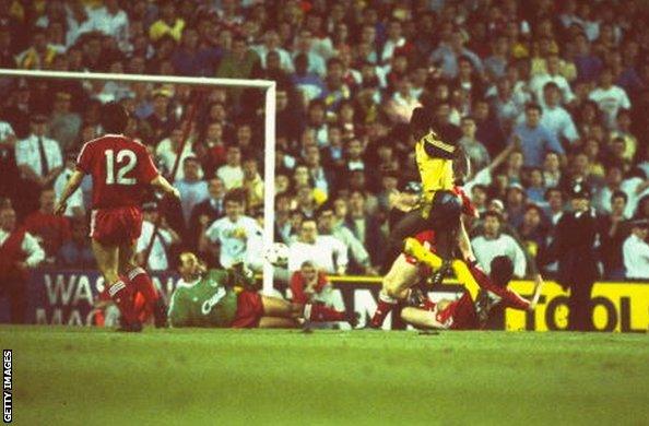 Michael Thomas scores for Arsenal against Liverpool at Anfield