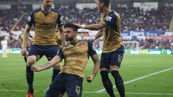 Olivier Giroud celebrates scoring Arsenal's first goal against Swansea