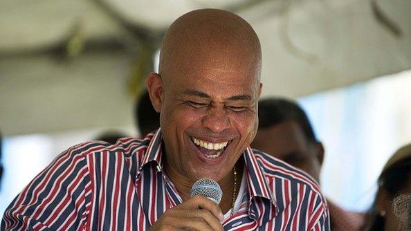 Haitian President Michel Martelly speaks to supporters while attending the inauguration of neighborhood of Morne Lazarre, in the commune of Petion Ville, Port-au-Prince, on April 17, 2015