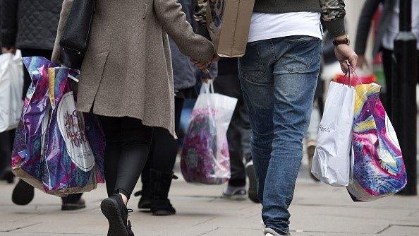 People walking with shopping bags