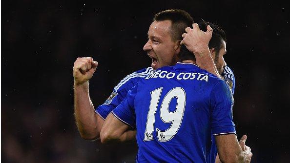 Chelsea forward Diego Costa celebrates his late equaliser against Manchester United with John Terry