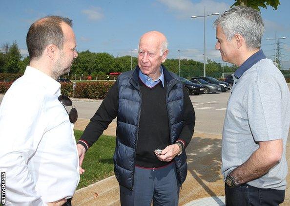 Jose Mourinho is pictured with Manchester United legend Sir Bobby Charlton (centre) at the club's training ground along with executive vice-chairman Ed Woodward