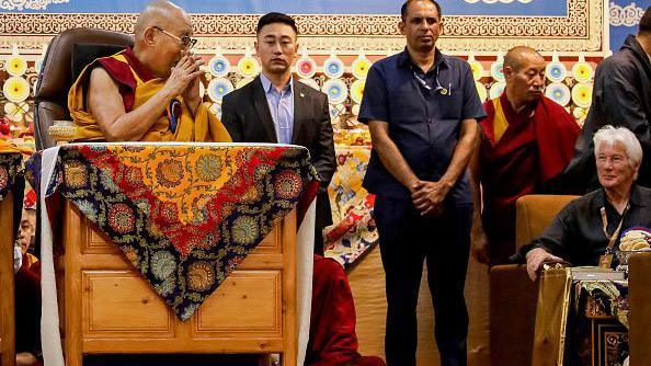 Tibetan spiritual leader the Dalai Lama (L) speaks with US actor Richard Gere (R) during a Long Life Prayer offering ceremony at the Main Tibetan Temple in McLeod Ganj, near Dharamsala on June 30, 2025. Exiled Tibetan spiritual leader, the Dalai Lama, gave on June 30, the strongest indication yet that the 600-year-old institution would continue after his death, at prayer celebrations for his 90th birthday. The leader, who turns 90 on July 6, is according to Tibetans the 14th reincarnation of the Dalai Lama. (Photo by Sanjay BAID / AFP) (Photo by SANJAY BAID/AFP via Getty Images)