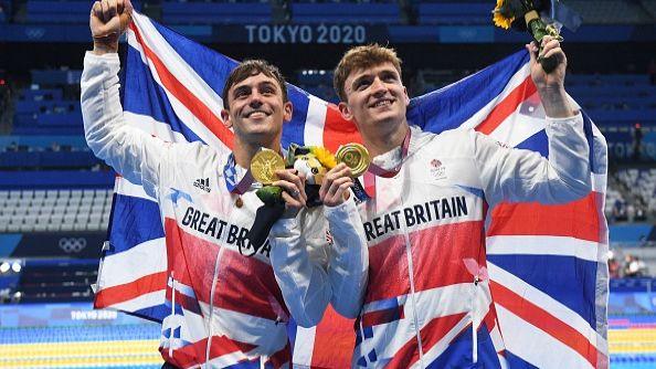 Tom Daley and Matty Lee pose with their medals after wining the men's synchronised 10m platform diving final event during the Tokyo 2020 Olympic Games.