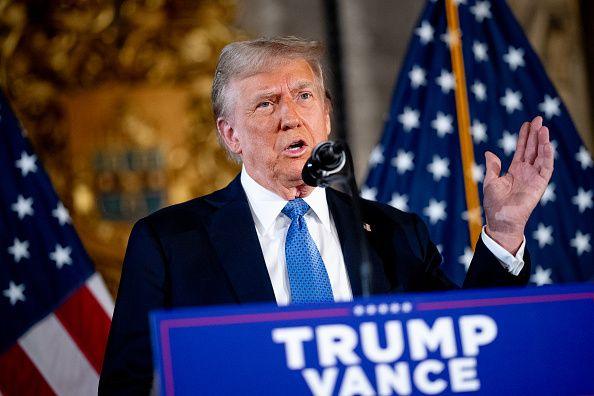 President-elect Donald Trump stands behind a lectern 