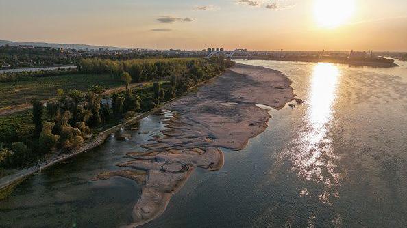 Aerial view shows sandbars appearing in the shallow water of the Danube River