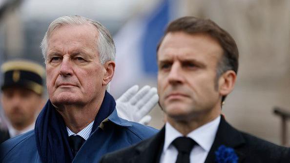 Picture shows France's former President Emmanuel Macron on the right and France's Prime Minister Michel Barnier on the left, standing at attention during commemorations marking the 106th anniversary of the November 11, 1918, Armistice, ending World War I (WWI), in Paris, on November 11, 2024