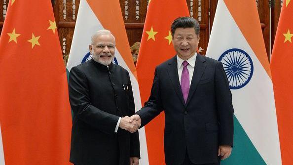 Prime Minister Narendra Modi shakes hands with Chinese President Xi Jinping (R) at the West Lake State Guest House in September 2016 in Hangzhou, China during the G20 Leaders Summit 