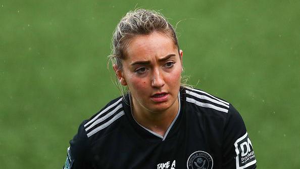 Footballer Maddy Cusack looks on while playing for Sheffield United Women in 2023