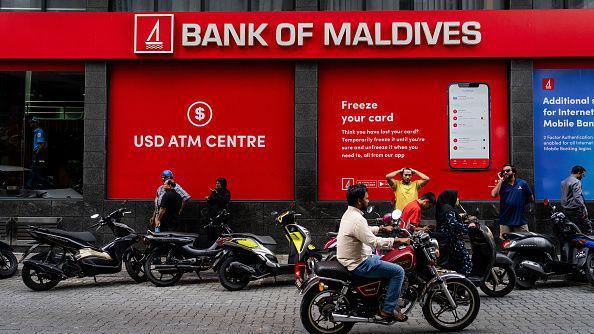 People outside of the Bank of Maldives in capital city Male