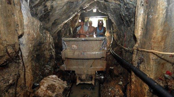 miners working inside a mine tunnel at the mining village of Mt. Diwata in the Compostela Valley on the southern Philippine island of Mindanao.