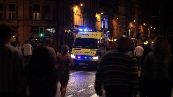 Ambulance and Saturday night revellers in Cardiff