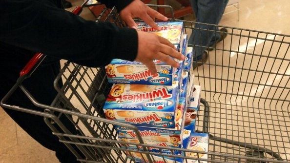 A customer stacks up Twinkies cakes