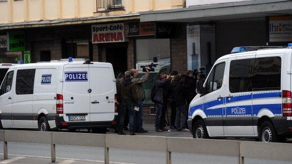 Police cars stand in front of the Millatu Ibrahim Mosque in Solingen, western Germany, on June 14, 2012