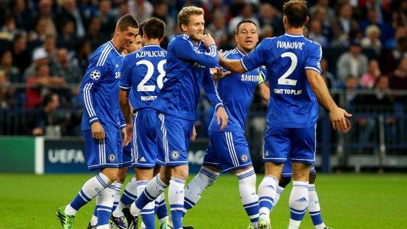 Chelsea players celebrate scoring against Schalke in the Champions League