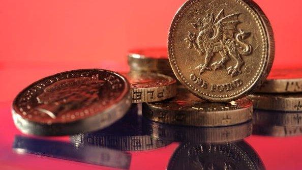 Pound coins in a pile