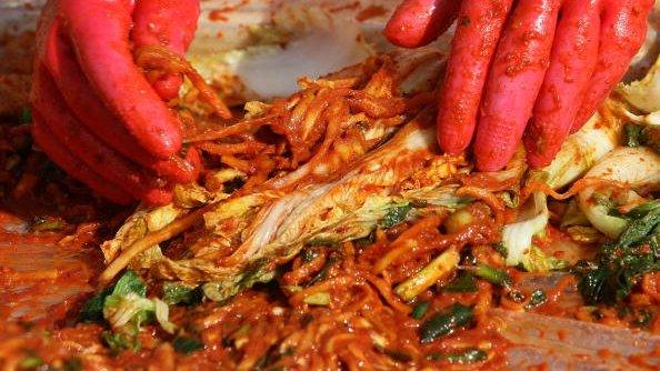 South Korean women make kimchi, a traditional pungent vegetable dish, in Seoul, South Korea, 9 November 2009