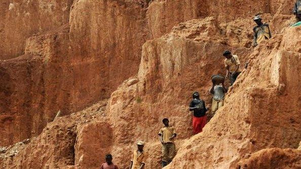 Workers up a mountain in the DR Congo