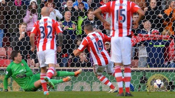 Stoke's Jonathan Walters scores from the penalty spot against Arsenal