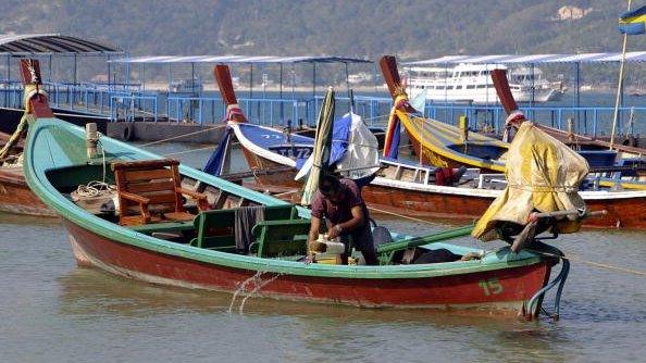 Thai man prepares his boat