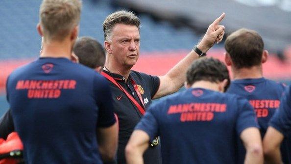 Manchester United head coach Louis van Gaal with players at a training session