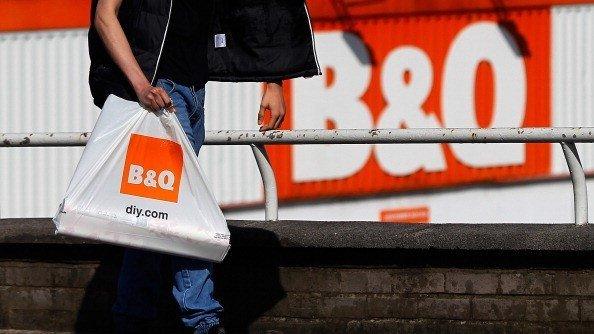 Shoppers walking past a B&Q store