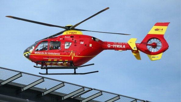 Air ambulance landing on hospital roof