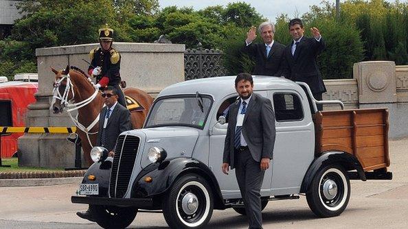 Newly sworn-in Uruguayan President Tabare Vazquez (left) and his Vice-President Raul Sendic wave atop a Fordson 1951 after leaving the Congress on his way to Plaza Independencia in Montevideo on 1 March, 2015.