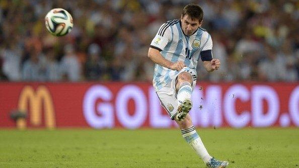 Lionel Messi in action for Argentina at the 2014 World Cup in front of a McDonald's advert