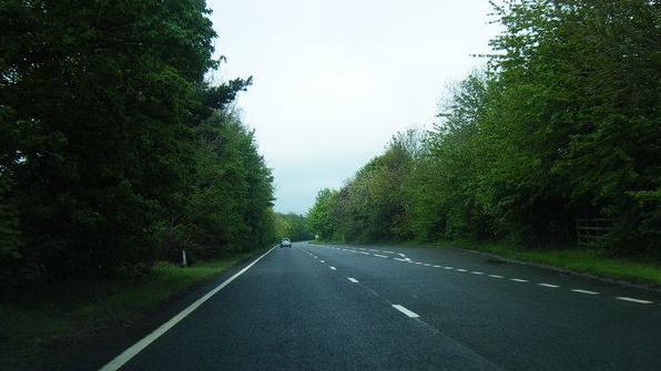 The A465, trees on either side.