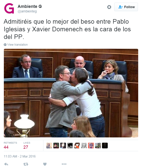 Translation: "You have to admit that the best part of this kiss between Pabloe Iglesias and Xavier Domenech is the looks on the faces of the PP" - the politicians from the conservative Popular Party who are looking on