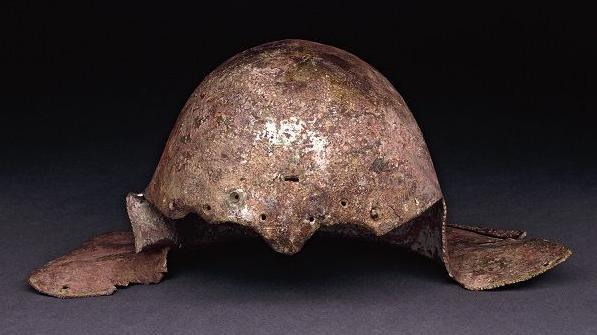 Britain's only surviving gladiator helmet - a domed bronze helmet with panels that would also protect the side of the head.