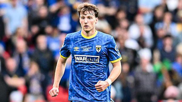 Riley Harbottle in action for Wimbledon during last season's League Two play-off final against Walsall