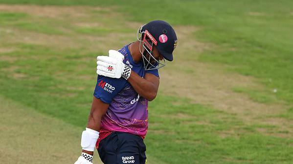 Emilio Gay clutching his right shoulder during Durham's match with Middlesex