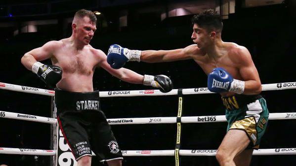 Abdul Khan throws a punch at Ricky Starkey