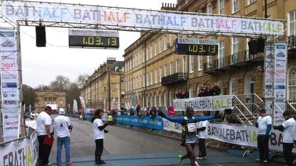 Winner Nicholas Kirui crosses the finish line in the 2014 Bath Half