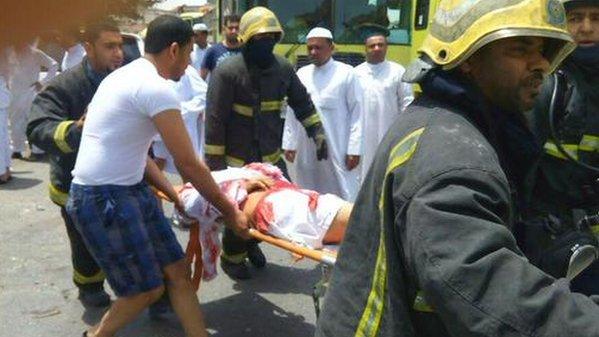 A casualty is stretchered away from Imam Ali mosque in al-Qadeeh, Saudi's Eastern Province, after a suicide bomber struck Friday prayers (image courtesy Middle East Eye)