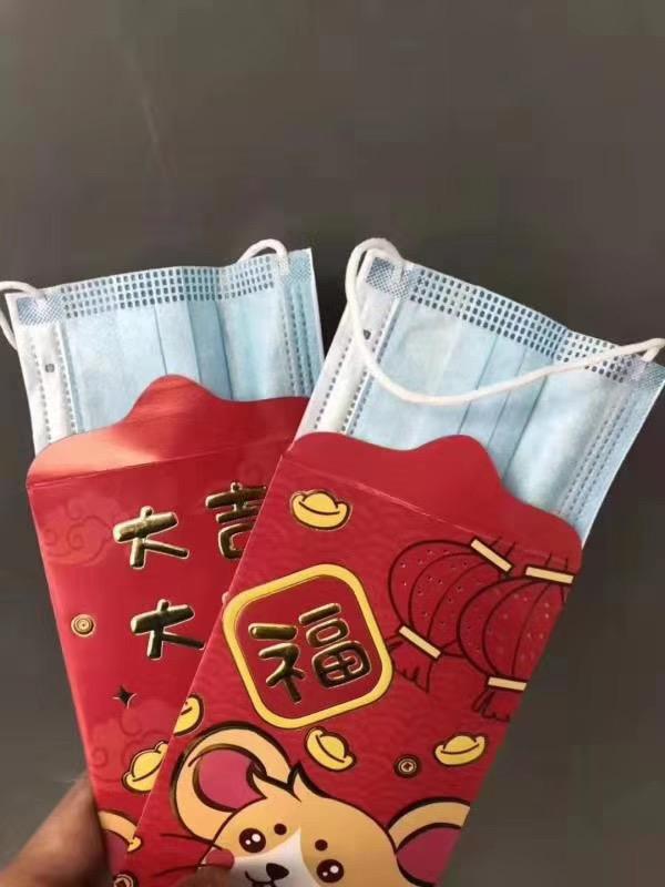 An image of red envelopes filled by surgical masks