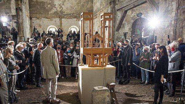 People standing around the organ