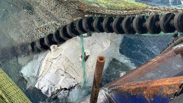 Part of the wreckage of the submerged Cessna 172 is pulled from the seabed in the fishing nets of the Benarkle II trawler.