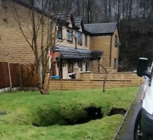 Image-shows-garden-where-hole-has-opened-up-in-front-garden.