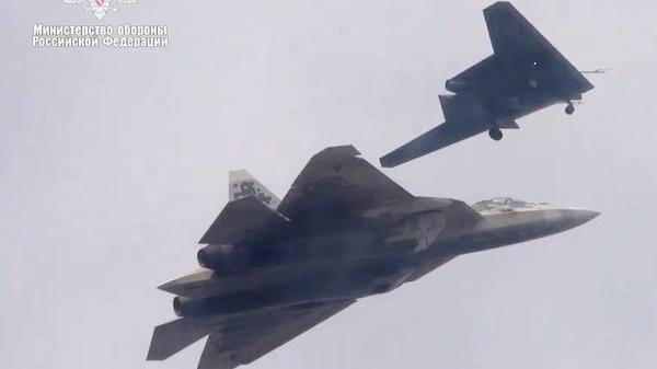 This old Russian defence ministry picture shows the Su-57 jet flying in tandem with the Okhotnik combat drone 